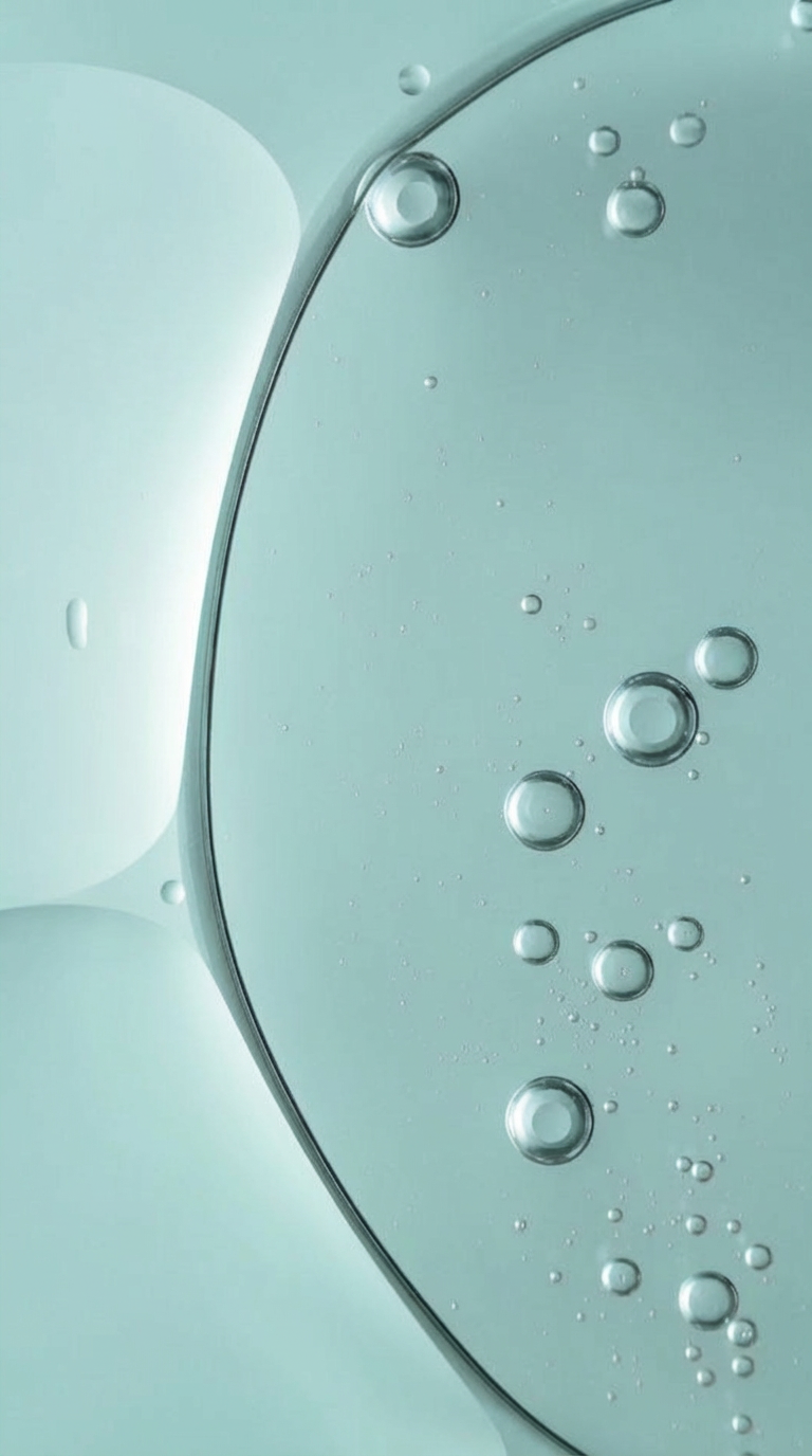 Macro shot of clear liquid ceramide serum with air bubbles suspended within it.